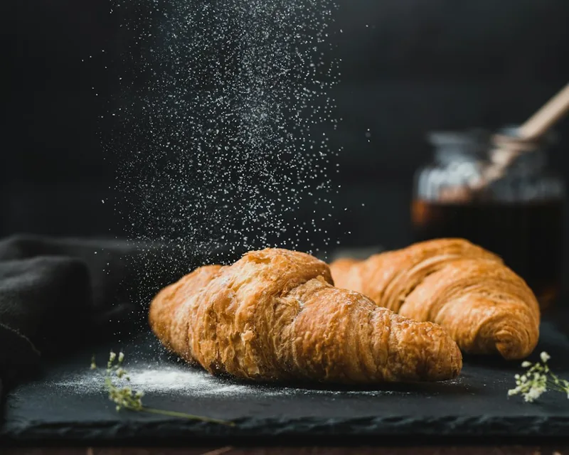 Butter croissants on a dark board